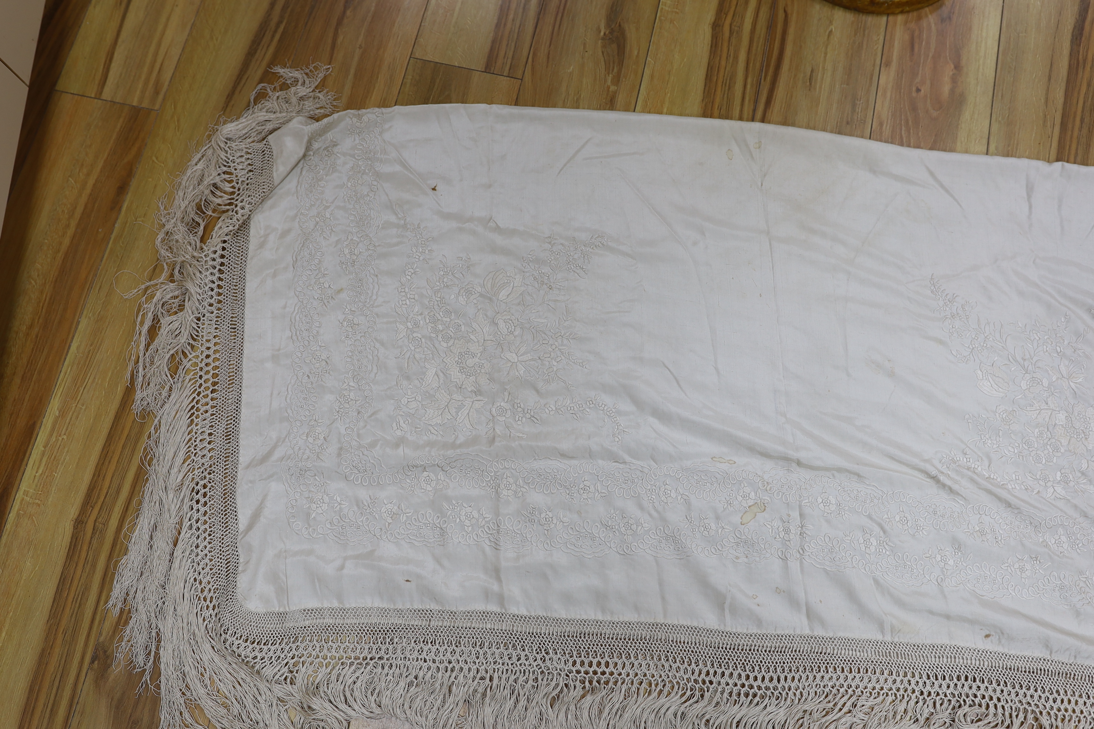 A Canton cream silk embroidered shawl, 136cm x 138cm